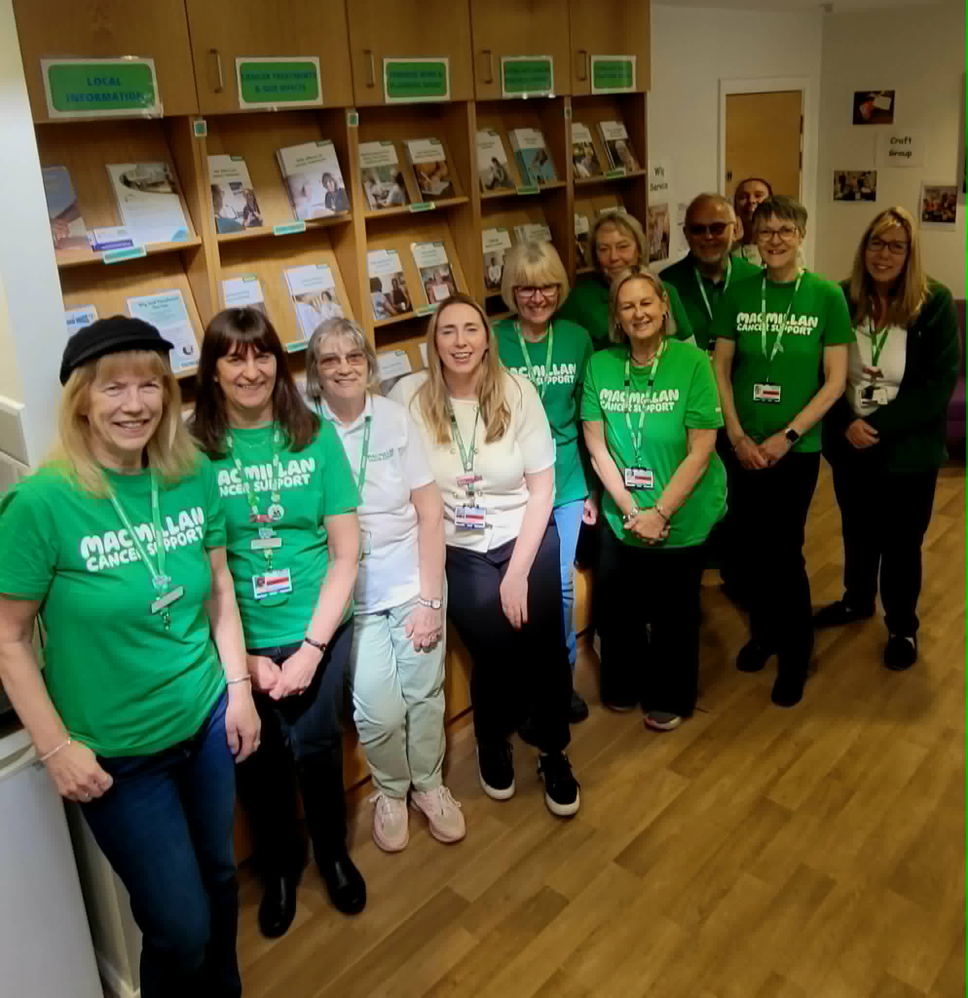 Group shot of vols near wooden leaflet holder
